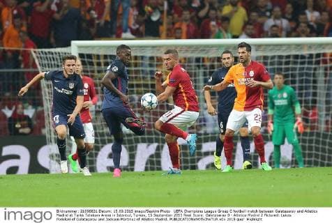 UEFA Champions League Group C football match between Galatasaray and Atletico Madrid at Turkk Telekom Arena in Istanbul, Turkey, 15 September 2015 Final Score: Galatasaray 0 - Atletico Madrid 2 Pictured: Lukas Podolski of Galatasaray and Jackson Martinez of Atletico Madrid. 