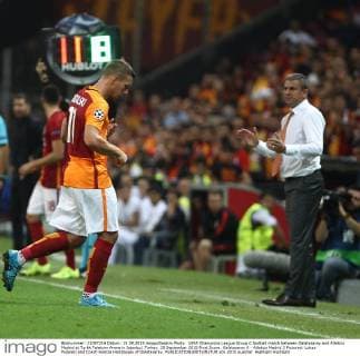 UEFA Champions League Group C football match between Galatasaray and Atletico Madrid at Turkk Telekom Arena in Istanbul, Turkey, 15 September 2015 Final Score: Galatasaray 0 - Atletico Madrid 2 Pictured: Lukas Podolski and Coach Hamza Hamzaoglu of Galatasaray. 