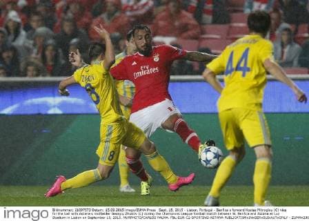 Sept. 15, 2015 - Lisbon, Portugal - Benfica s forward Kostas Mitroglou (C) vies for the ball with Astana s midfielder Georgiy Zhukov (L) during the Champions League football match between SL Benfica and Astana at Luz Stadium in Lisbon on September 15, 2015. NURPHOTO CARLOS PALMA. FBL-EUR-C1-SPORTING-ASTANA  - ZUMAn230