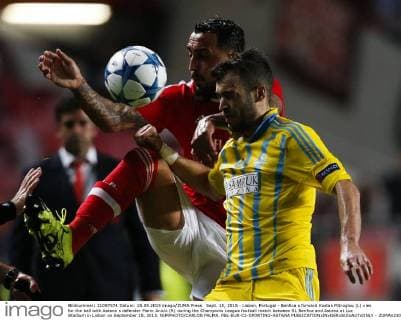 Sept. 15, 2015 - Lisbon, Portugal - Benfica s forward Kostas Mitroglou (L) vies for the ball with Astana s defender Marin Anicic (R) during the Champions League football match between SL Benfica and Astana at Luz Stadium in Lisbon on September 15, 2015. NURPHOTO CARLOS PALMA. FBL-EUR-C1-SPORTING-ASTANA  - ZUMAn230