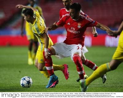 Sept. 15, 2015 - Lisbon, Portugal - Benfica s midfielder Andreas Samaris (R) vies for the ball with Astana s midfielder Georgiy Zhukov (L) during the Champions League football match between SL Benfica and Astana at Luz Stadium in Lisbon on September 15, 2015. NURPHOTO CARLOS PALMA. FBL-EUR-C1-SPORTING-ASTANA  - ZUMAn230
