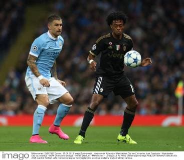 Aleksander Kolarov of Manchester City and Juventus Juan Cuadrado - Manchester City vs Juventus - UEFA Champions League - Etihad Stadium - Manchester - 15 09 2015 Pic Philip Oldham SportImage EDITORIAL USE ONLY. No use with unauthorised audio, video, data, fixture lists, club league logos or live services. Online in-match use limited to 120 images, no video emulation. No use in betting, games or single club league player publications.