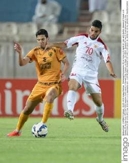 Mohamad Dommarani (R) of Syria s Al Jaish SC vies with Sultan Alenezi of Kuwait s Al Qadsia SC during their AFC CUP 2015 quarter-final match in Kuwait City, Kuwait, on Sept. 15, 2015. Qadsia SC lost 0-2 and advanced to the semi-finals of the 2015 AFC Cup 2015 with a 3-2 aggregate win. ) (SP)KUWAIT-KUWAIT CITY-AFC CUP 2015- AL JAISH SC VS AL QADSIA SC NoufalxIbrahim 