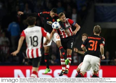 Chris Smalling of Manchester United ManU FC (CL), Luuk de Jong of PSV (CR) during the UEFA Champions League group B match between PSV Eindhoven and Manchester United on September 15, 2015 at the Philips stadium in Eindhoven, The Netherlands. PSV Eindhoven v Manchester United UEFA Champions League 2015 2016 xVIxJeroenxPutmansxIVx 4333033