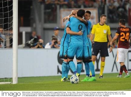 Rome, Italy - Roma s forward Luis Suarez celebrates after scoring a goal 1-0 with teammates during the champions league football match AS Roma vs Barcelona FC at the Olympic Stadium in Rome, on september 16, 2015. AS Roma v FC Barcelona Barca - UEFA Champions League  - ZUMAn230