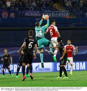SOCCER - CL, Zagreb vs Arsenal ZAGREB,CROATIA,16.SEP.15 - SOCCER - UEFA Champions League, group stage, GNK Dinamo Zagreb vs FC Arsenal. Image shows Eduardo Carvalho (Zagreb) and Laurent Koscielny (Arsenal). GEPAxpictures xMaticxKlansek