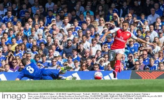 Football - 2015 16 - Barclays Premier League - Chelsea Vs Arsenal. Chelsea s Oscar comes sliding in on Arsenal s Alexis Sanchez at Stamford Bridge. COLORSPORT DANIEL BEARHAM  che_ars