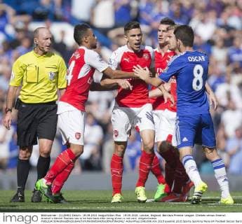19.09.2015. London, England. Barclays Premier League. Chelsea versus Arsenal. Arsenal s Gabriel Paulista has to be held back after being shown a red card. xNigelxCookex  ActionPlus11661806