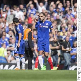 19.09.2015. London, England. Barclays Premier League. Chelsea versus Arsenal. Captain for the day Chelsea s Branislav Ivanovic points to his head in reference to teammate Chelsea s Diego Costa needing to calm down. xNigelxCookex  ActionPlus11661808