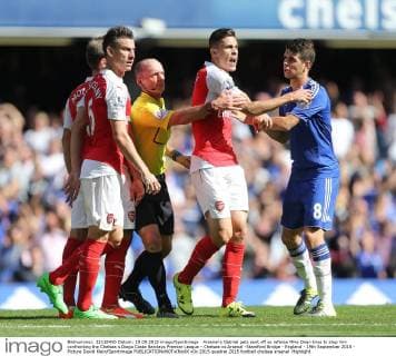 Arsenal s Gabriel gets sent off as referee Mike Dean tries to stop him confronting the Chelsea s Diego Costa Barclays Premier League - Chelsea vs Arsenal -Stamford Bridge - England - 19th September 2015 - Picture David Klein Sportimage EDITORIAL USE ONLY. No use with unauthorised audio, video, data, fixture lists, club league logos or live services. Online in-match use limited to 120 images, no video emulation. No use in betting, games or single club league player publications.