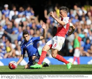 Chelsea s Oscar catches Arsenal s Laurent Koscielny with his studs Barclays Premier League - Chelsea vs Arsenal -Stamford Bridge - England - 19th September 2015 - Picture David Klein Sportimage EDITORIAL USE ONLY. No use with unauthorised audio, video, data, fixture lists, club league logos or live services. Online in-match use limited to 120 images, no video emulation. No use in betting, games or single club league player publications.