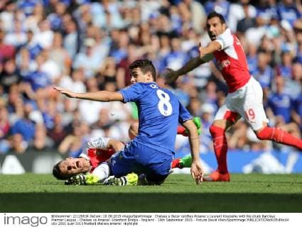 Chelsea s Oscar catches Arsenal s Laurent Koscielny with his studs Barclays Premier League - Chelsea vs Arsenal -Stamford Bridge - England - 19th September 2015 - Picture David Klein Sportimage EDITORIAL USE ONLY. No use with unauthorised audio, video, data, fixture lists, club league logos or live services. Online in-match use limited to 120 images, no video emulation. No use in betting, games or single club league player publications.