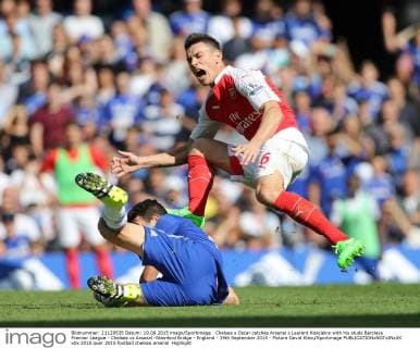 Chelsea s Oscar catches Arsenal s Laurent Koscielny with his studs Barclays Premier League - Chelsea vs Arsenal -Stamford Bridge - England - 19th September 2015 - Picture David Klein Sportimage EDITORIAL USE ONLY. No use with unauthorised audio, video, data, fixture lists, club league logos or live services. Online in-match use limited to 120 images, no video emulation. No use in betting, games or single club league player publications.