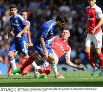 Chelsea s Cesc Fabregas tussles with Arsenal s Laurent Koscielny Barclays Premier League - Chelsea vs Arsenal -Stamford Bridge - England - 19th September 2015 - Picture David Klein Sportimage EDITORIAL USE ONLY. No use with unauthorised audio, video, data, fixture lists, club league logos or live services. Online in-match use limited to 120 images, no video emulation. No use in betting, games or single club league player publications.