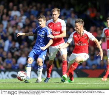 Chelsea s Oscar tussles with Arsenal s Aaron Ramsey Barclays Premier League - Chelsea vs Arsenal -Stamford Bridge - England - 19th September 2015 - Picture David Klein Sportimage EDITORIAL USE ONLY. No use with unauthorised audio, video, data, fixture lists, club league logos or live services. Online in-match use limited to 120 images, no video emulation. No use in betting, games or single club league player publications.