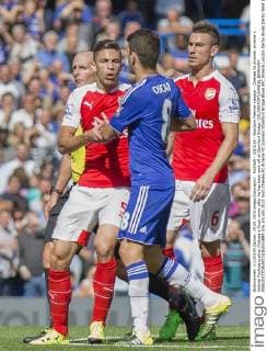 Football - 2015 16 - Barclays Premier League - Chelsea Vs Arsenal. Arsenal s Gabriel Paulista pushes Chelsea s Oscar away after he has been sent off at Stamford Bridge. COLORSPORT DANIEL BEARHAM  che_ars