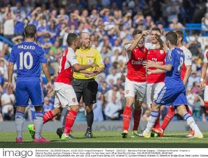 Football - 2015 16 - Barclays Premier League - Chelsea Vs Arsenal. Arsenal s Gabriel Paulista pushes Chelsea s Oscar away after he has been sent off at Stamford Bridge. COLORSPORT DANIEL BEARHAM  che_ars