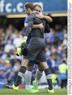 Football - 2015 16 - Barclays Premier League - Chelsea Vs Arsenal. Chelsea s Branislav Ivanovic hugs Arsenal s Petr Cech at the end of the game at Stamford Bridge. COLORSPORT DANIEL BEARHAM  che_ars