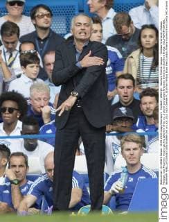 Football - 2015 16 - Barclays Premier League - Chelsea Vs Arsenal. Chelsea Manager Jose Mourinho tries to get the attention of his no. 2 player and captain Branislav Ivanovic at Stamford Bridge. COLORSPORT DANIEL BEARHAM  che_ars