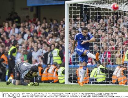 Football - 2015 16 - Barclays Premier League - Chelsea Vs Arsenal. Chelsea s Pedro kicks the ball away in celebration while a dejected Petr Cech lies on the floor at Stamford Bridge. COLORSPORT DANIEL BEARHAM  che_ars