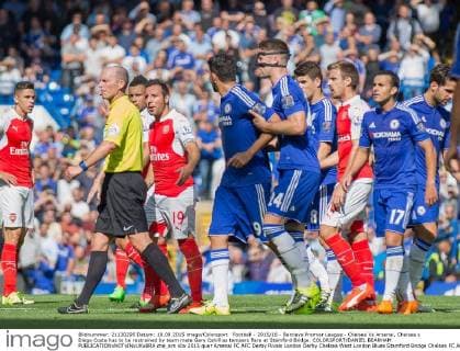 Football - 2015 16 - Barclays Premier League - Chelsea Vs Arsenal. Chelsea s Diego Costa has to be restrained by team mate Gary Cahill as tempers flare at Stamford Bridge. COLORSPORT DANIEL BEARHAM  che_ars