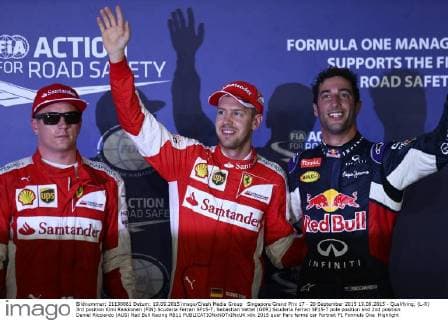 Singapore Grand Prix 17 - 20 September 2015 19.09.2015 - Qualifying, (L-R) 3rd position Kimi Raikkonen (FIN) Scuderia Ferrari SF15-T, Sebastian Vettel (GER) Scuderia Ferrari SF15-T pole position and 2nd position Daniel Ricciardo (AUS) Red Bull Racing RB11 