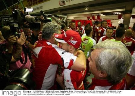 Singapore Grand Prix 17 - 20 September 2015 20.09.2015 - Race, Celebratrion, Sebastian Vettel (GER) Scuderia Ferrari SF15-T race winner and 3rd position Kimi Raikkonen (FIN) Scuderia Ferrari SF15-T 