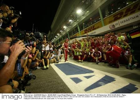 Singapore Grand Prix 17 - 20 September 2015 20.09.2015 - Race, Celebratrion, Sebastian Vettel (GER) Scuderia Ferrari SF15-T race winner and 3rd position Kimi Raikkonen (FIN) Scuderia Ferrari SF15-T 
