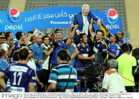 Sept. 21, 2015 - Cairo, Cairo, Egypt - El-Zamalek Chairman Mortada Mansour and players celebrate with the trophy after winning their Egyptian Cup finals derby soccer match against Al-Ahly at Petro stadium in Cairo, Egypt, September 21, 2015 Middle East News - Sept. 21, 2015 - ZUMAap3_
