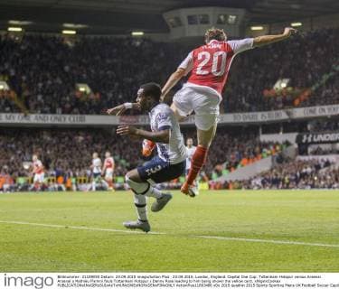 23.09.2015. London, England. Capital One Cup. Tottenham Hotspur versus Arsenal. Arsenal s Mathieu Flamini fouls Tottenham Hotspur s Danny Rose leading to him being shown the yellow card. xNigelxCookex  ActionPlus11663486