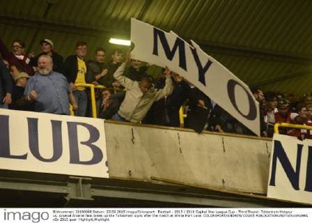Football - 2015 2016 Capital One League Cup - Third Round: Tottenham Hotspur vs. Arsenal Arsenal fans break up the Tottenham signs after the match at White Hart Lane. COLORSPORT ANDREW COWIE 