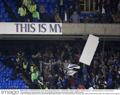23.09.2015. London, England. Capital One Cup. Tottenham Hotspur versus Arsenal. The Arsenal fans tear down the This is My Club sign on the stand at the final whistle. xNigelxCookex  ActionPlus11663624