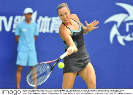 Jelena Jankovic of Serbia returns a shot against Svetlana Kuznetsova of Dubai in their quarterfinal match of the women s singles during the 2015 WTA Tennis Damen Guangzhou Open tennis tournament in Guangzhou city, south China s Guangdong province, 24 September 2015. Jelena Jankovic of Serbia defeated Svetlana Kuznetsova of Dubai 2-0 (6-2 7-5) at their quarterfinal of the women s singles during the 2015 WTA Guangzhou Open tennis tournament. Jelena Jankovic eliminates Svetlana Kuznetsova at quarterfinal of WTA Guangzhou Open  20150924_34398