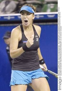 Bencic at Pan Pacific Open Switzerland s Belinda Bencic reacts after winning a point against Garbine Muguruza of Spain at the Pan Pacific Open on Sept. 25, 2015, at the Ariake Tennis Forest Park in Tokyo. Bencic advanced to the semifinals. 