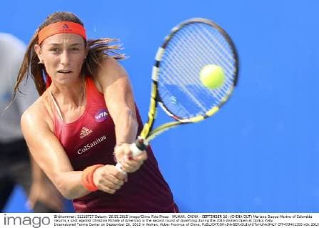 WUHAN, CHINA - SEPTEMBER 26: (CHINA OUT) Mariana Duque-Marino of Colombia returns a shot against Christina Mchale of American in the second round of Qualifying during the 2015 Wuhan Open at Optics Vally International Tennis Center on September 26, 2015 in Wuhan, Hubei Province of China.  CFP473461355 