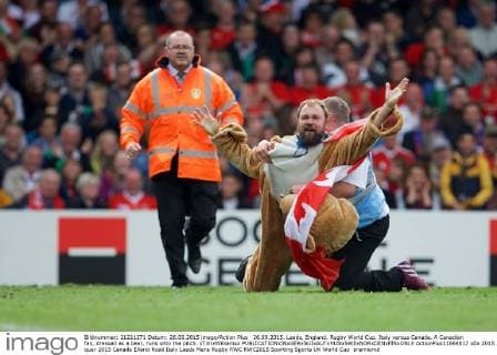 26.09.2015. Leeds, England. Rugby World Cup. Italy versus Canada. A Canadian fan, dressed as a bear, runs onto the pitch. xTimxWilliamsx  ActionPlus11664817