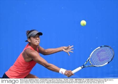 WUHAN, CHINA - SEPTEMBER 27: (CHINA OUT) Teliana Pereira of Brazil returns a shot against Daria Gavrilova of Russia in the fist round of 2015 Wuhan Open at Optics Vally International Tennis Center on September 26, 2015 in Wuhan, Hubei Province of China.  CFP473508530 