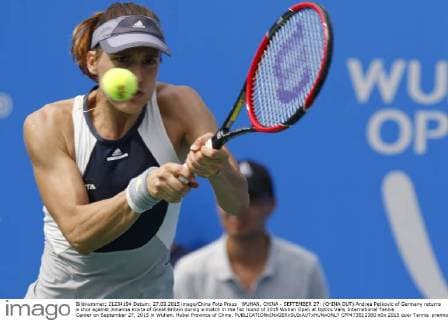 WUHAN, CHINA - SEPTEMBER 27: (CHINA OUT) Andrea Petkovic of Germany returns a shot against Johanna Konta of Great Britain during a match in the fist round of 2015 Wuhan Open at Optics Vally International Tennis Center on September 27, 2015 in Wuhan, Hubei Province of China.  CFP473512380 