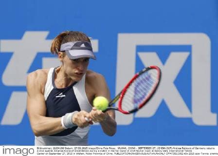 WUHAN, CHINA - SEPTEMBER 27: (CHINA OUT) Andrea Petkovic of Germany returns a shot against Johanna Konta of Great Britain during a match in the fist round of 2015 Wuhan Open at Optics Vally International Tennis Center on September 27, 2015 in Wuhan, Hubei Province of China.  CFP473512382 