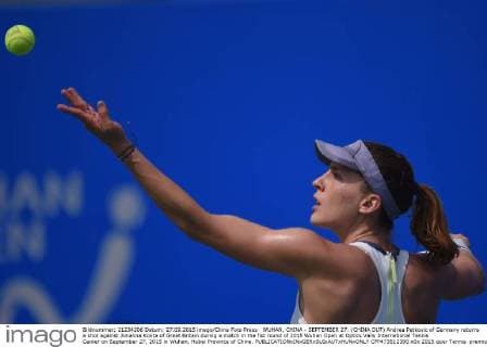 WUHAN, CHINA - SEPTEMBER 27: (CHINA OUT) Andrea Petkovic of Germany returns a shot against Johanna Konta of Great Britain during a match in the fist round of 2015 Wuhan Open at Optics Vally International Tennis Center on September 27, 2015 in Wuhan, Hubei Province of China.  CFP473512390 