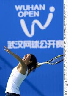 WUHAN, CHINA - SEPTEMBER 27: (CHINA OUT) Francesca Schiavone of Italy in action during a match against Abigail Spears and Raquel Kops-Jones of America in the first round of 2015 Wuhan Open at Optics Vally International Tennis Center on September 27, 2015 in Wuhan, Hubei Province of China.  CFP473517180 