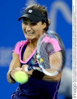 WUHAN, CHINA - SEPTEMBER 27: (CHINA OUT) Monica Niculescu of Romania returns a shot against Fangzhou Liu of China during a match in the first round of 2015 Wuhan Open at Optics Vally International Tennis Center on September 27, 2015 in Wuhan, Hubei Province of China.  CFP473523032 