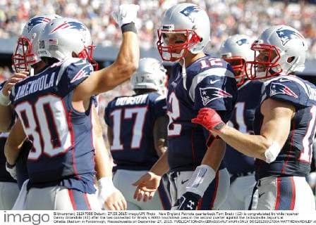 New England Patriots quarterback Tom Brady (12) is congratulated by wide receiver Danny Amendola (80) after the two connected for Brady s 400th touchdown pass in the second quarter against the Jacksonville Jaguars at Gillette Stadium in Foxborough, Massachusetts on September 27, 2015.  BOS2015092706A MATTHEWxHEALEY