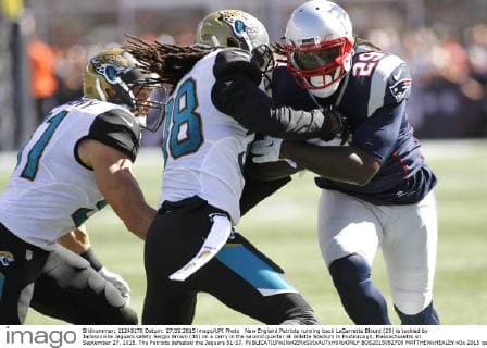 New England Patriots running back LeGarrette Blount (29) is tackled by Jacksonville Jaguars safety Sergio Brown (38) on a carry in the second quarter at Gillette Stadium in Foxborough, Massachusetts on September 27, 2015. The Patriots defeated the Jaguars 51-17.  BOS2015092709 MATTHEWxHEALEY