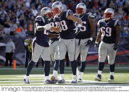 New England Patriots running back LeGarrette Blount (29) is congratulated by tight end Scott Chandler (88) after Blount scored on a one-yard carry in the fourth quarter against the Jacksonville Jaguars at Gillette Stadium in Foxborough, Massachusetts on September 27, 2015. The Patriots defeated the Jaguars 51-17.  BOS2015092712 MATTHEWxHEALEY
