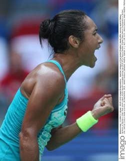 Heather Watson of the United Kingdom reacts after scoring against Jelena Jankovic of Serbia in their first round match of the women s singles during the 2015 WTA Tennis Damen Wuhan Open tennis tournament in Wuhan city, central China s Hubei province, 28 September 2015. Jelena Jankovic defeated Heather Watson 2-1 (6 3, 2 6, 6 3). Jelena Jankovic beats Heather Watson at Wuhan Open  20150928_12435