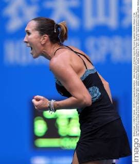 Jelena Jankovic of Serbia reacts after scoring against Heather Watson of the United Kingdom in their first round match of the women s singles during the 2015 WTA Tennis Damen Wuhan Open tennis tournament in Wuhan city, central China s Hubei province, 28 September 2015. Jelena Jankovic defeated Heather Watson 2-1 (6 3, 2 6, 6 3). Jelena Jankovic beats Heather Watson at Wuhan Open  20150928_50359