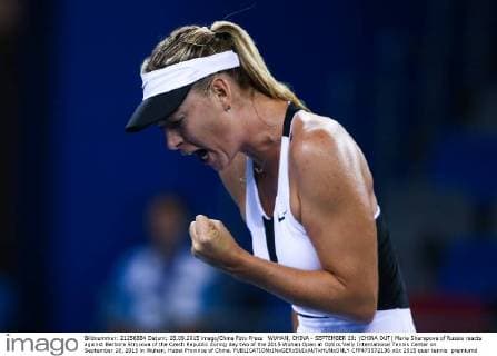 WUHAN, CHINA - SEPTEMBER 28: (CHINA OUT) Maria Sharapova of Russia reacts against Barbora Strycova of the Czech Republic during day two of the 2015 Wuhan Open at Optics Vally International Tennis Center on September 28, 2015 in Wuhan, Hubei Province of China.  CFP473572136 