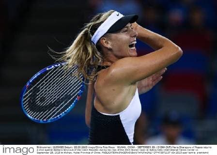 WUHAN, CHINA - SEPTEMBER 28: (CHINA OUT) Maria Sharapova of Russia returns a shot against Barbora Strycova of the Czech Republic during day two of the 2015 Wuhan Open at Optics Vally International Tennis Center on September 28, 2015 in Wuhan, Hubei Province of China.  CFP473572137 