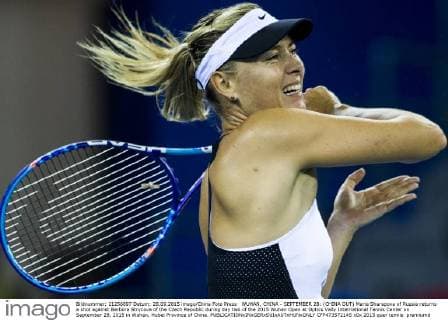 WUHAN, CHINA - SEPTEMBER 28: (CHINA OUT) Maria Sharapova of Russia returns a shot against Barbora Strycova of the Czech Republic during day two of the 2015 Wuhan Open at Optics Vally International Tennis Center on September 28, 2015 in Wuhan, Hubei Province of China.  CFP473572145 